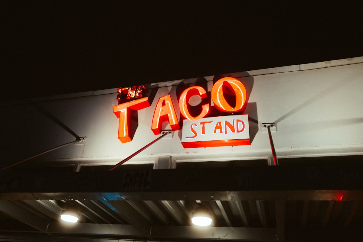 Neon taco stand glowing in the Miami night