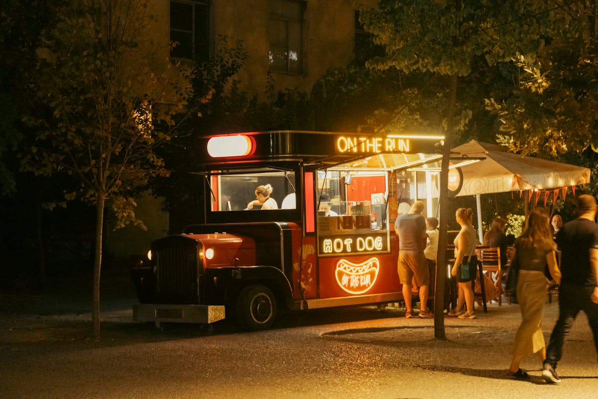 Food truck serving at night in urban setting
